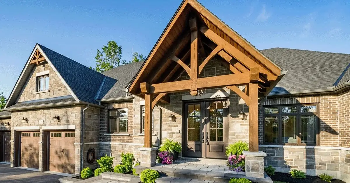 Timber frame front entry porch on modern stone and brick home