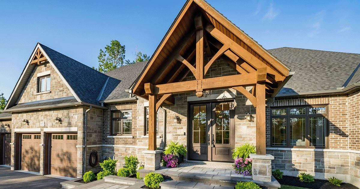Luxury home exterior with timber frame front entry