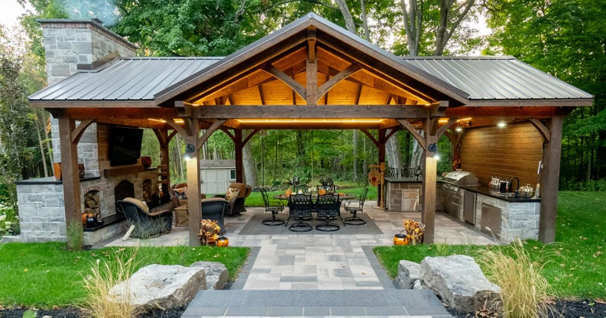 Modern backyard timber pavilion with outdoor kitchen and fireplace
